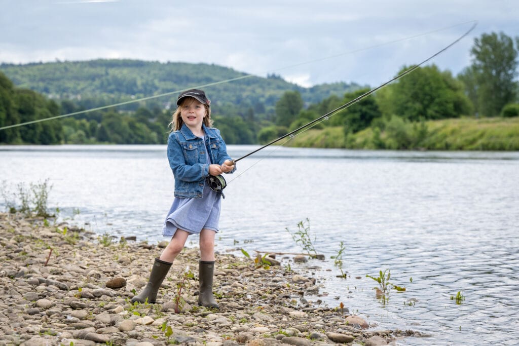 Little girl is fishing