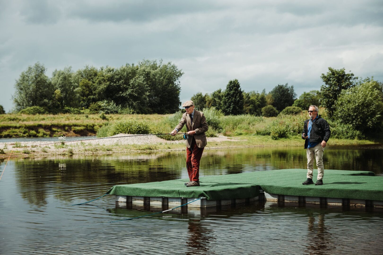 2 men fishing on a lake